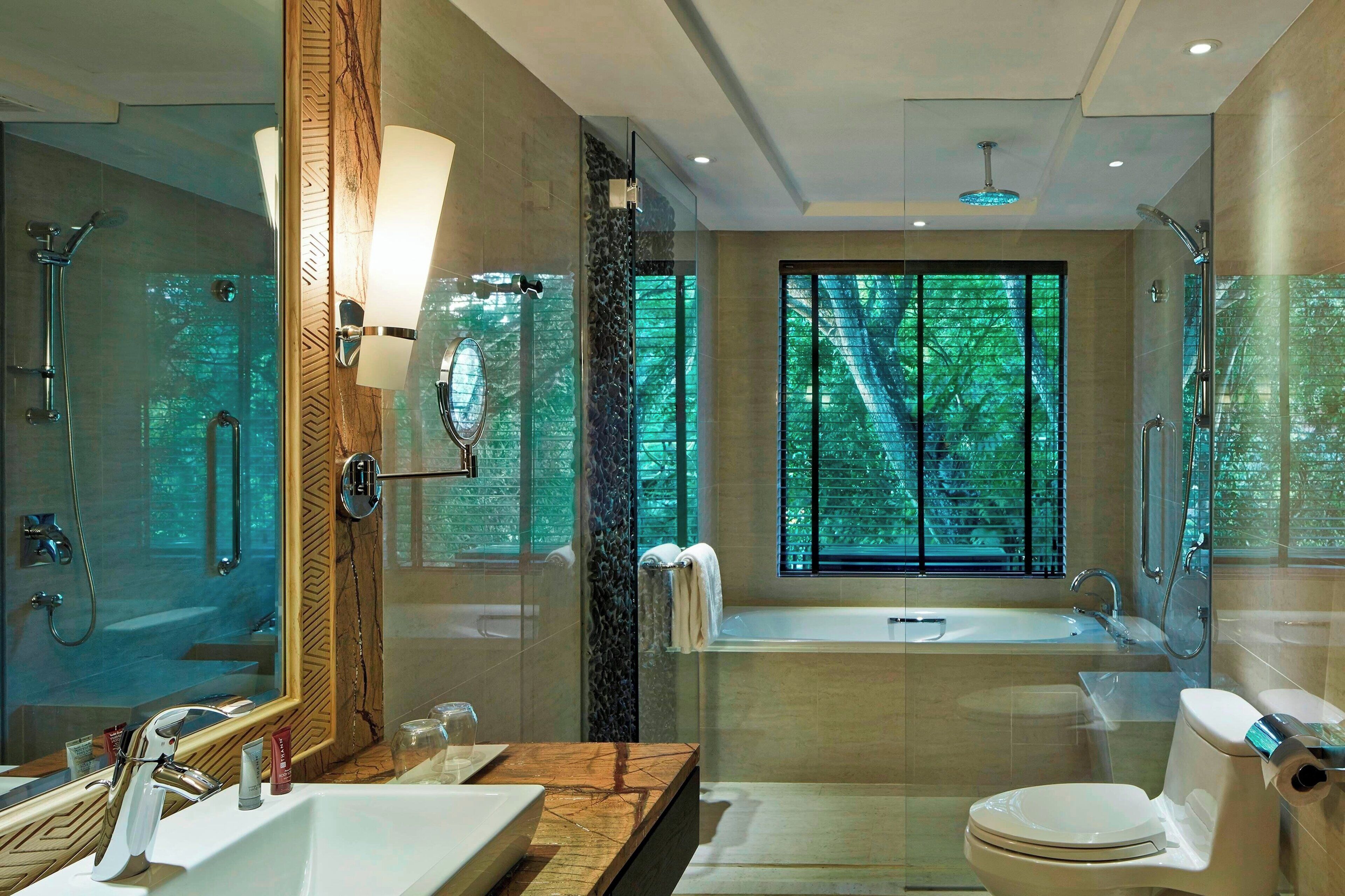 separate bathtub and shower, deep-soaking bathtub, rainfall showerhead