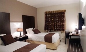 Luxe beddengoed, een minibar, een kluis op de kamer, een bureau