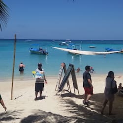 On the beach, white sand, sun-loungers, beach umbrellas