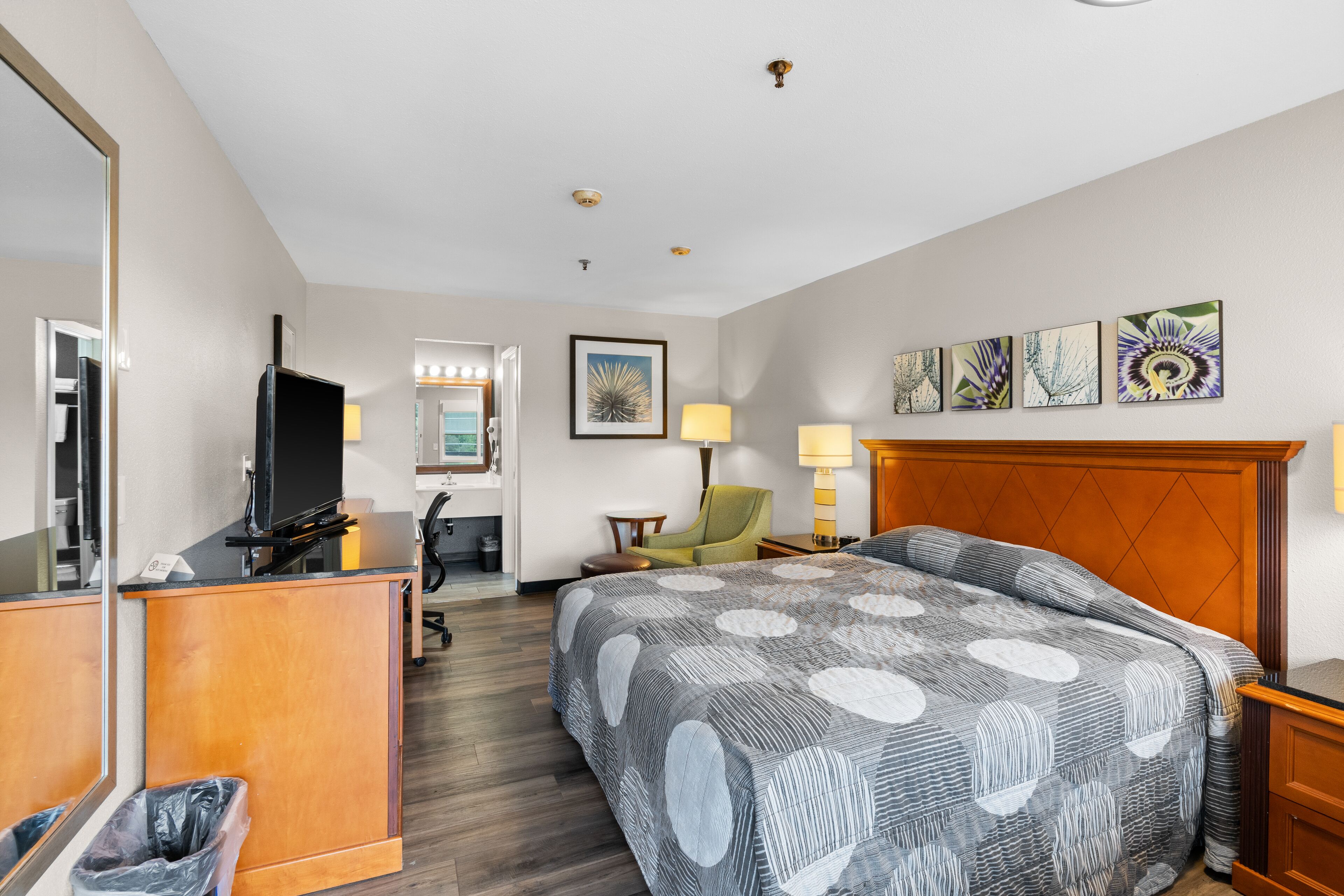 Desk, iron/ironing board, bed sheets