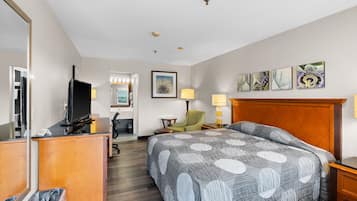 Desk, iron/ironing board, bed sheets