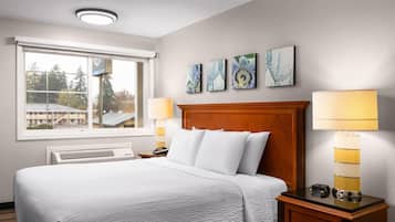 Desk, iron/ironing board, bed sheets