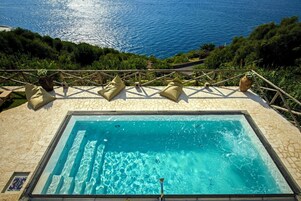 Outdoor pool, open 8:00 AM to 7:00 PM, pool umbrellas, sun loungers