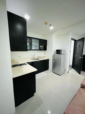 Apartamento, 2 habitaciones | Cocina privada | Frigorífico, microondas, placa de cocina y lavavajillas