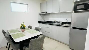 Apartment, 2 Bedrooms | Private kitchen | Fridge, microwave, stovetop, dishwasher