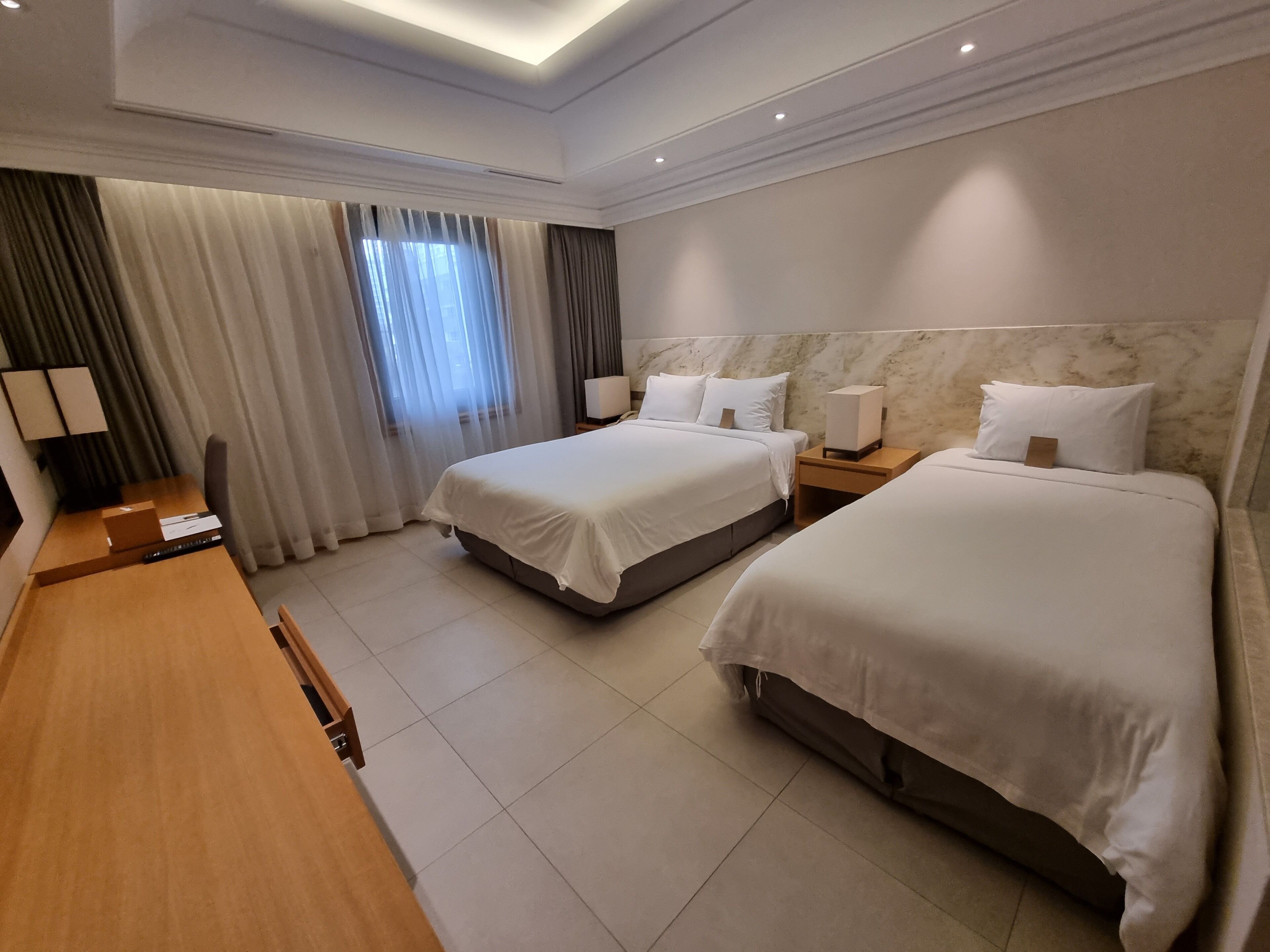 deluxe family twin room a (city view) | 2 bedrooms, premium bedding, in-room safe, desk