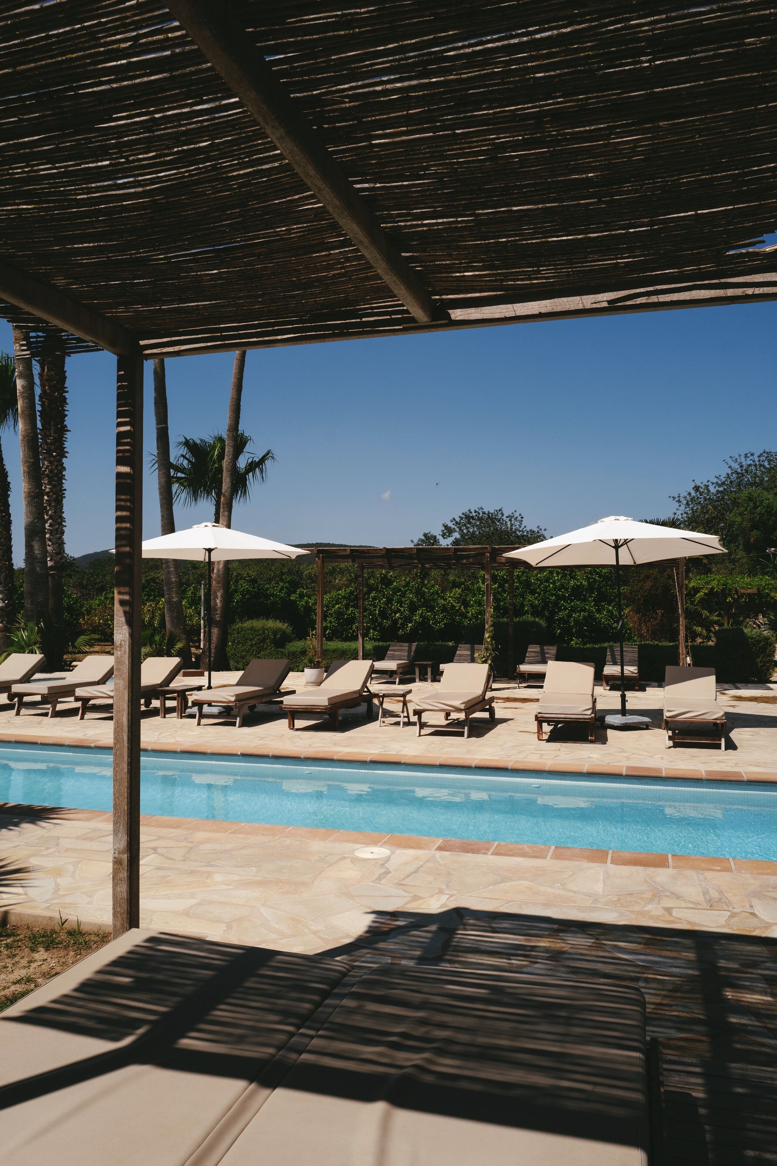 outdoor pool, pool umbrellas, pool loungers