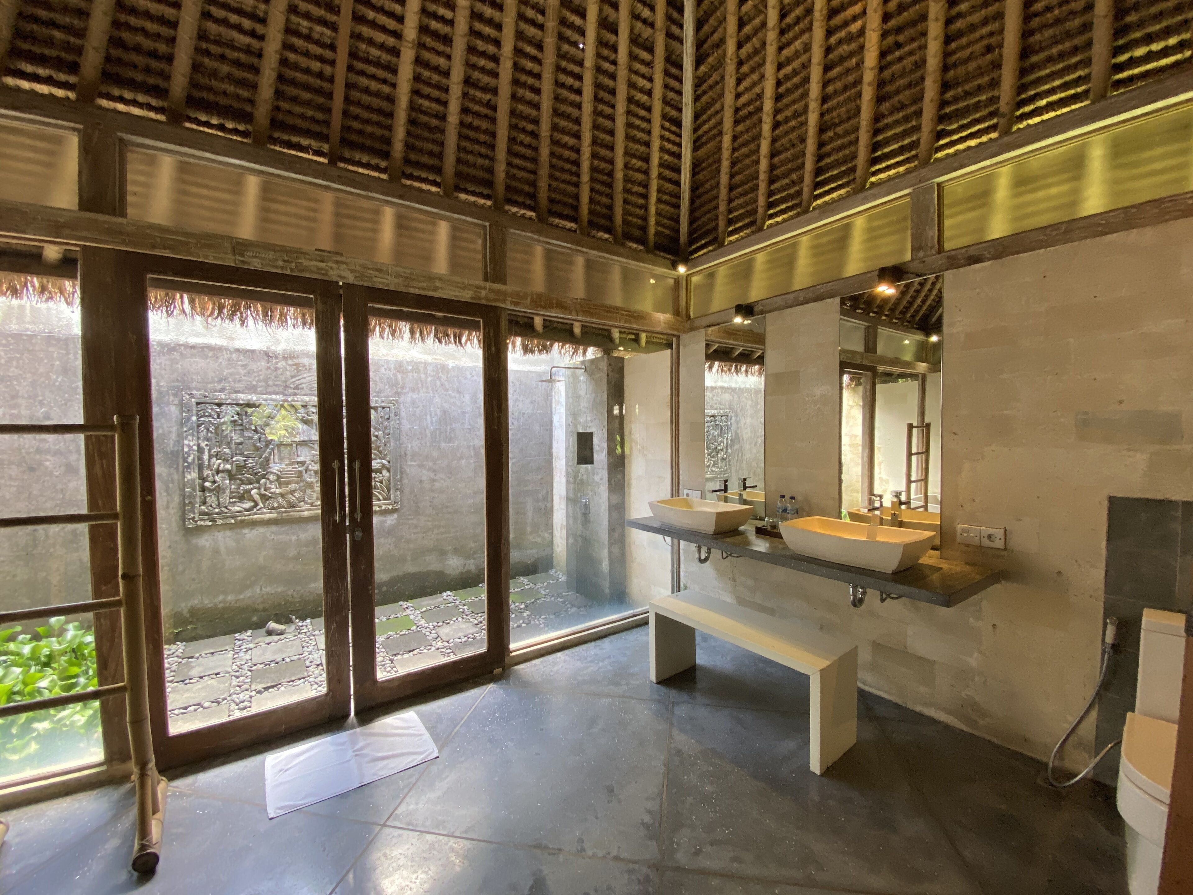 private wooden bungalow | bathroom | combined shower/bathtub, hair dryer, towels