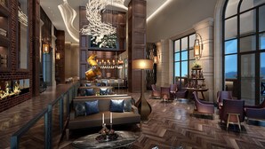 A spacious lobby with a high ceiling, modern lighting fixtures, and a bar area with seating. - Hilton Yuxi Fuxian Lake (Yuxi)