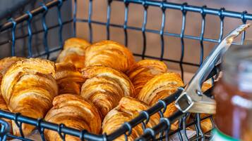 A basket filled with croissants.