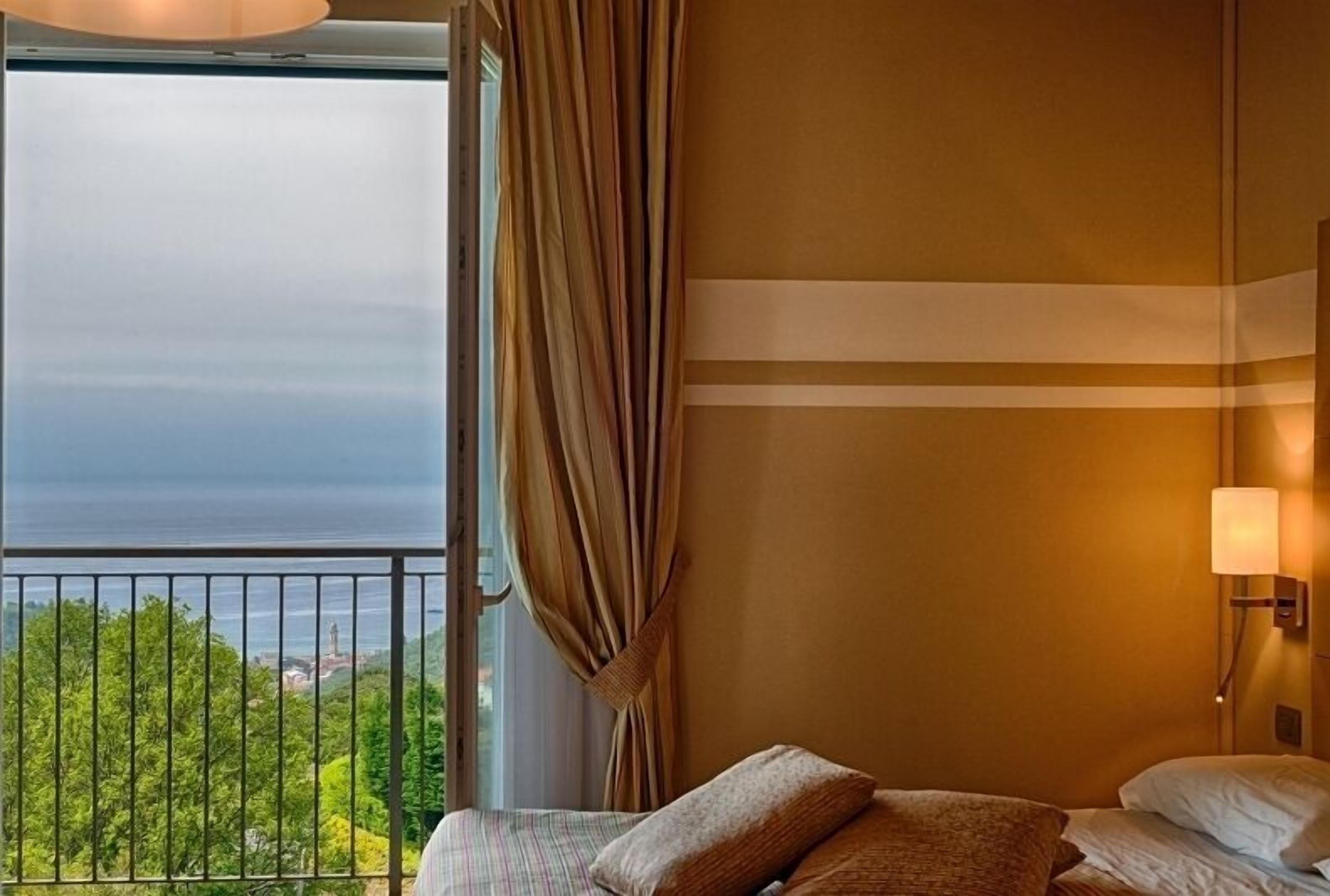 family room, sea view | minibar, in-room safe, individually furnished, desk