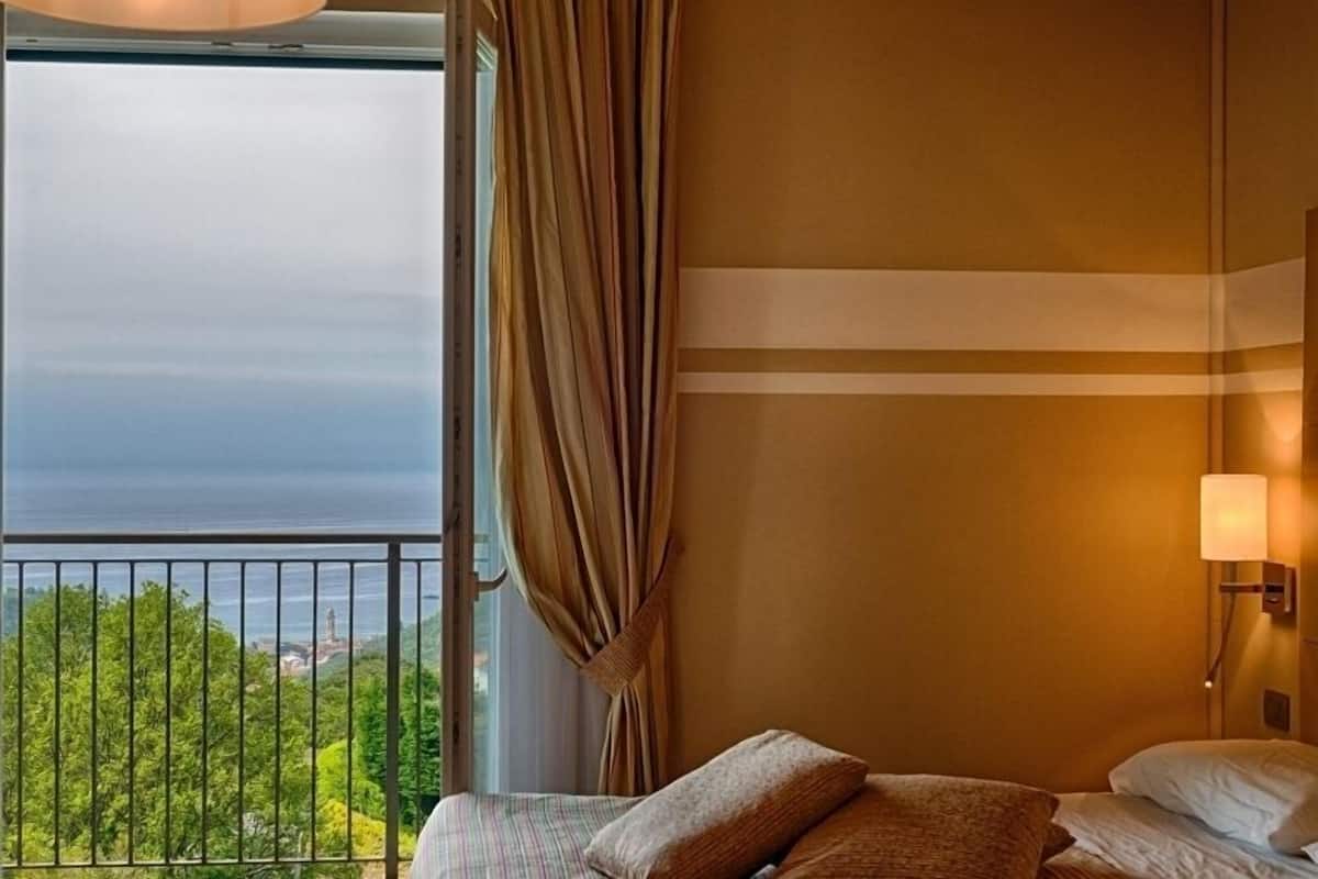 family room, sea view | minibar, in-room safe, individually furnished, desk