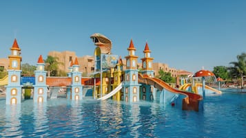 A water park with multiple slides and a castle-like structure.