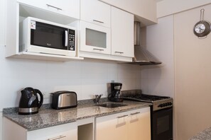 Apartment, 1 Bedroom | Private kitchen | Full-sized fridge, microwave, oven, stovetop - Terrazas Bariloche (San Carlos de Bariloche)
