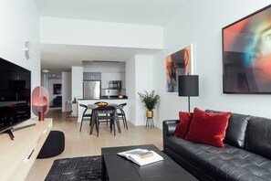 Deluxe One Bedroom, King (24/7 Front Desk) | Living area | 40-inch flat-screen TV with cable channels, TV