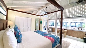 A four-poster bed with a view of the sea through a window. - Big Island Retreat (Kailua-Kona)