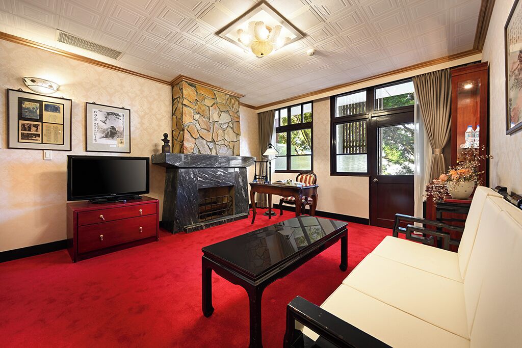historical building premium suite | living room | led tv, fireplace