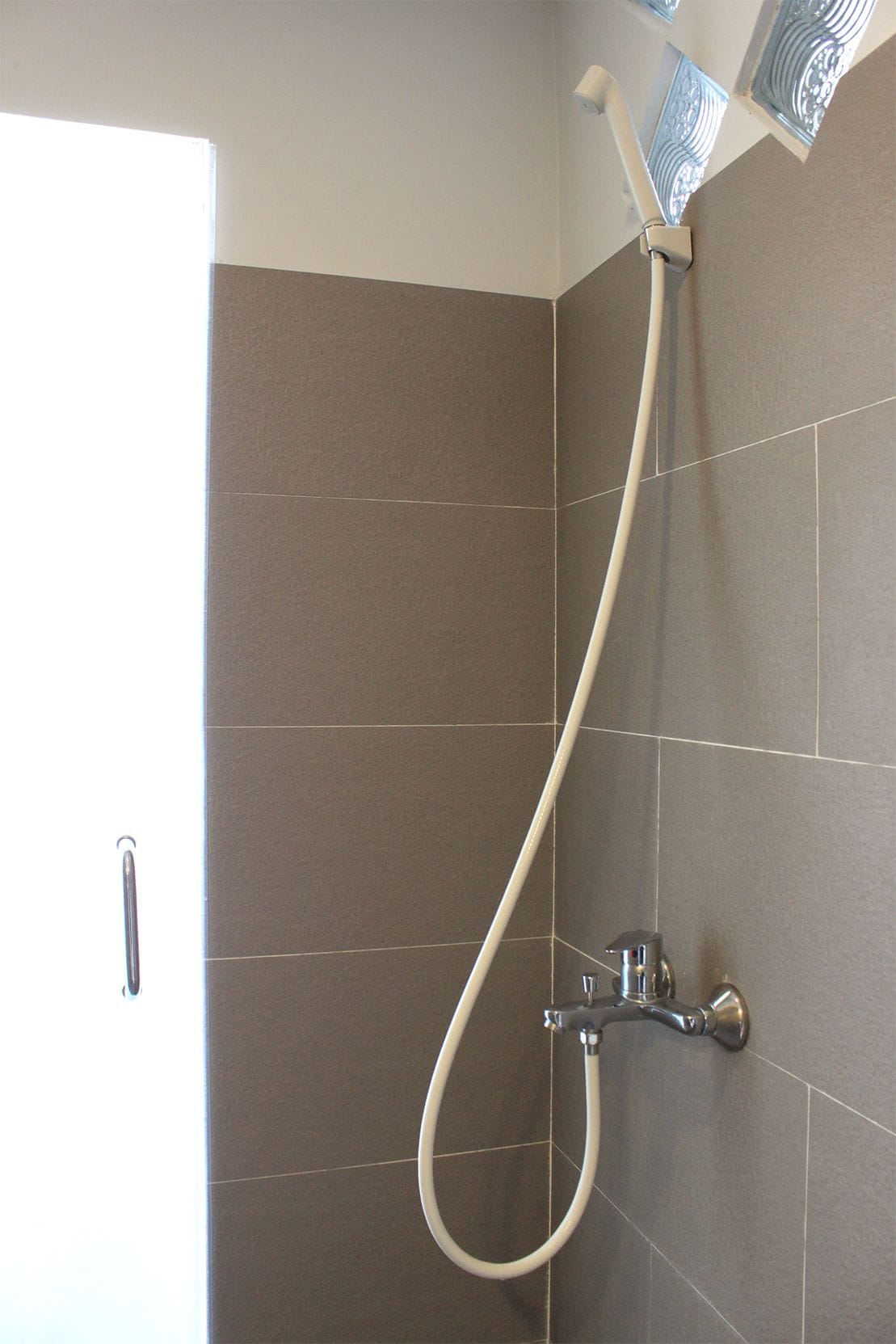 Family Triple Room, Multiple Beds, City View | Bathroom | Shower, hair dryer, slippers, bidet