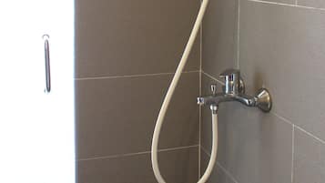 Family Triple Room, Multiple Beds, City View | Bathroom | Shower, hair dryer, slippers, bidet