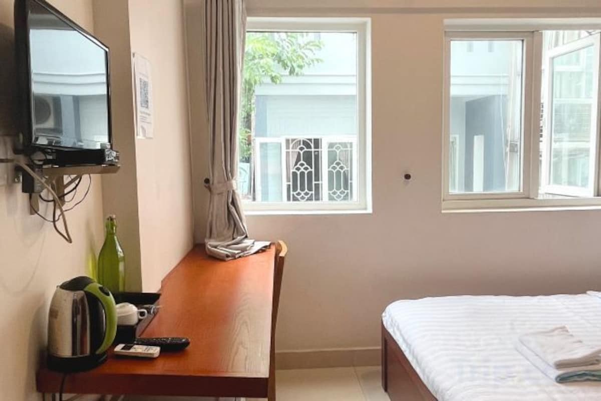 Desk, laptop workspace, blackout curtains, free WiFi