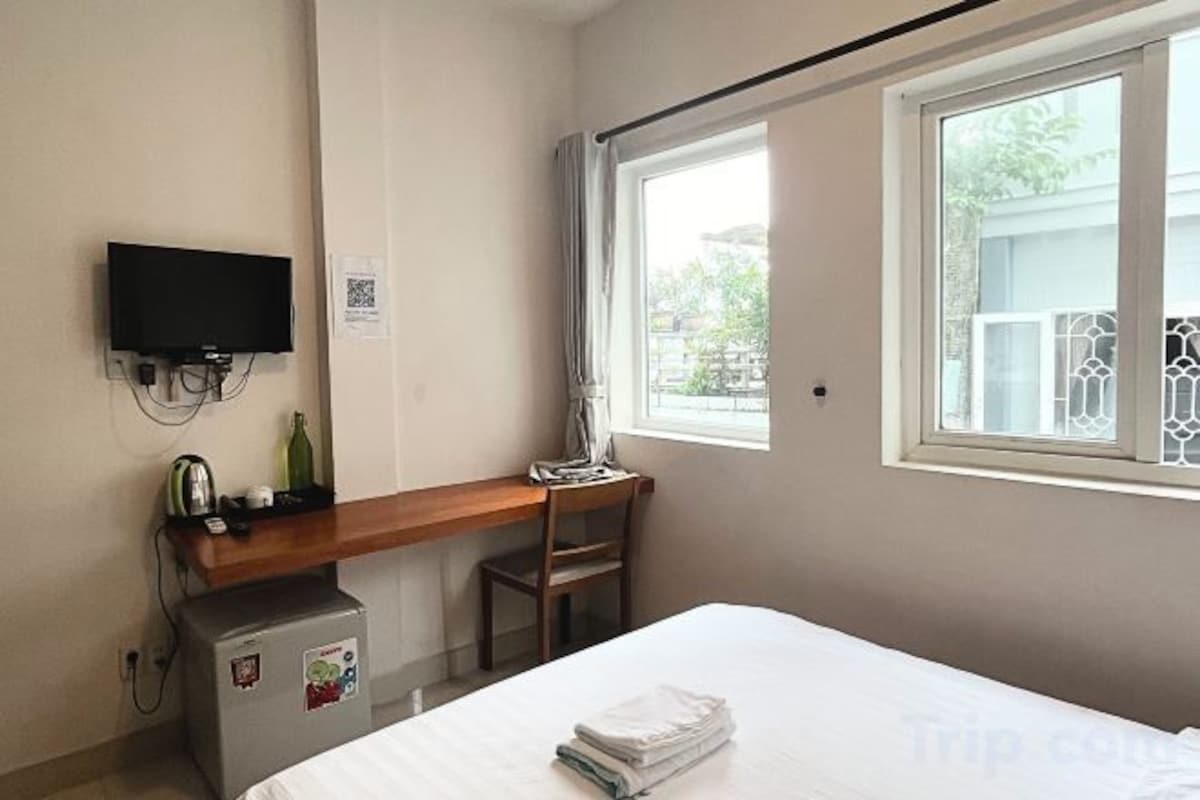 Desk, laptop workspace, blackout curtains, free WiFi