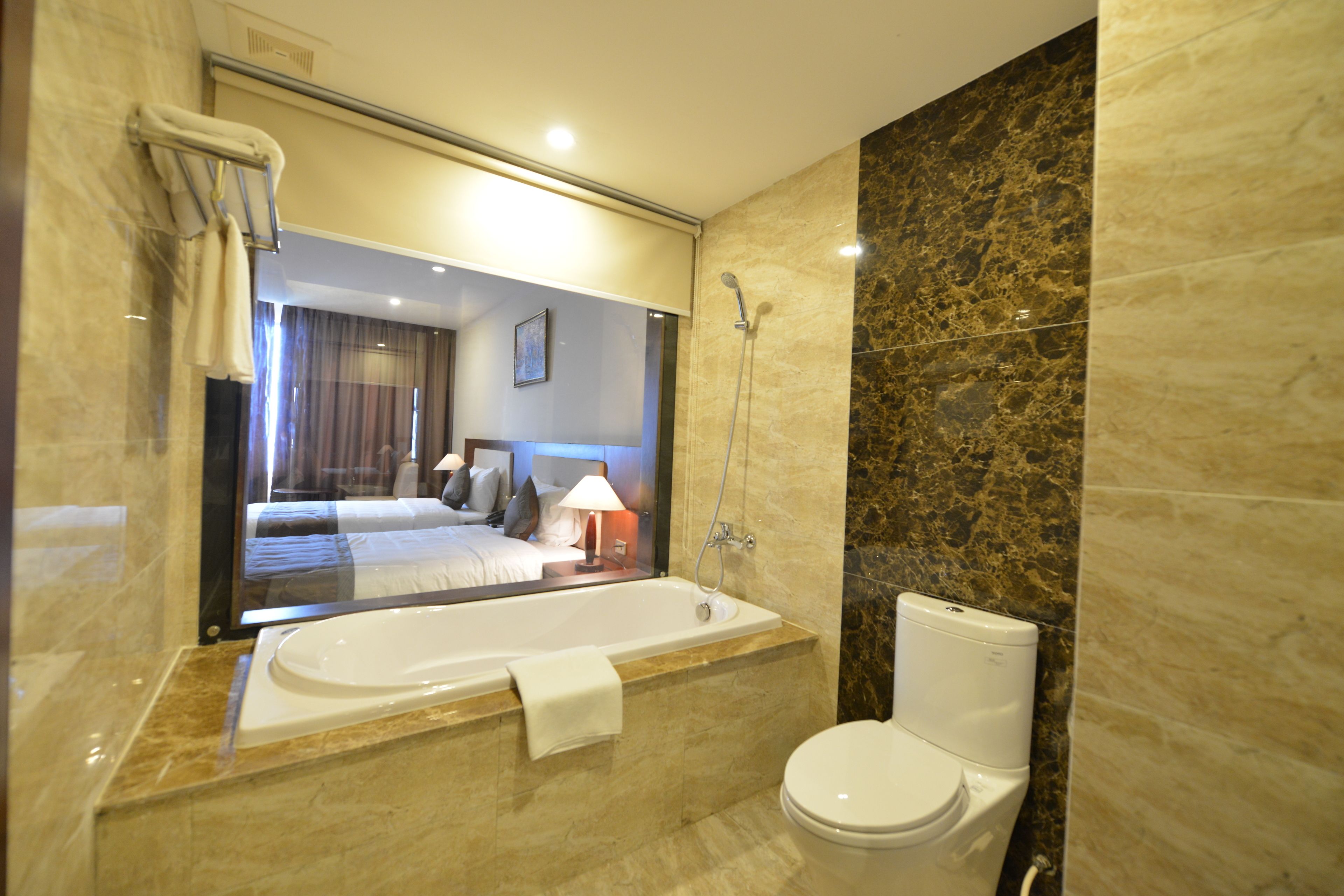 deluxe double room | bathroom | shower, free toiletries, hair dryer, slippers