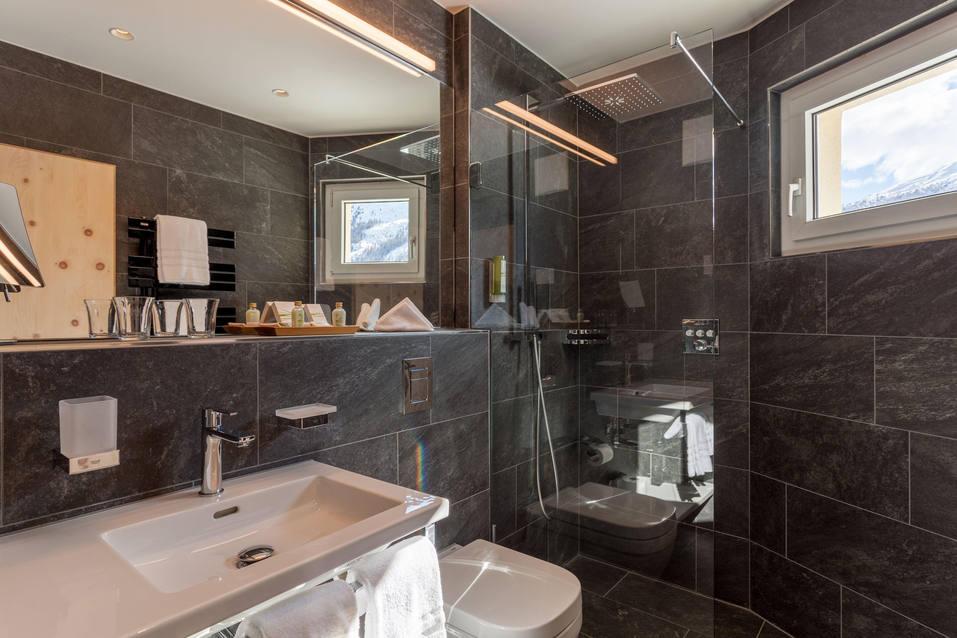 hair dryer, bathrobes, slippers, towels