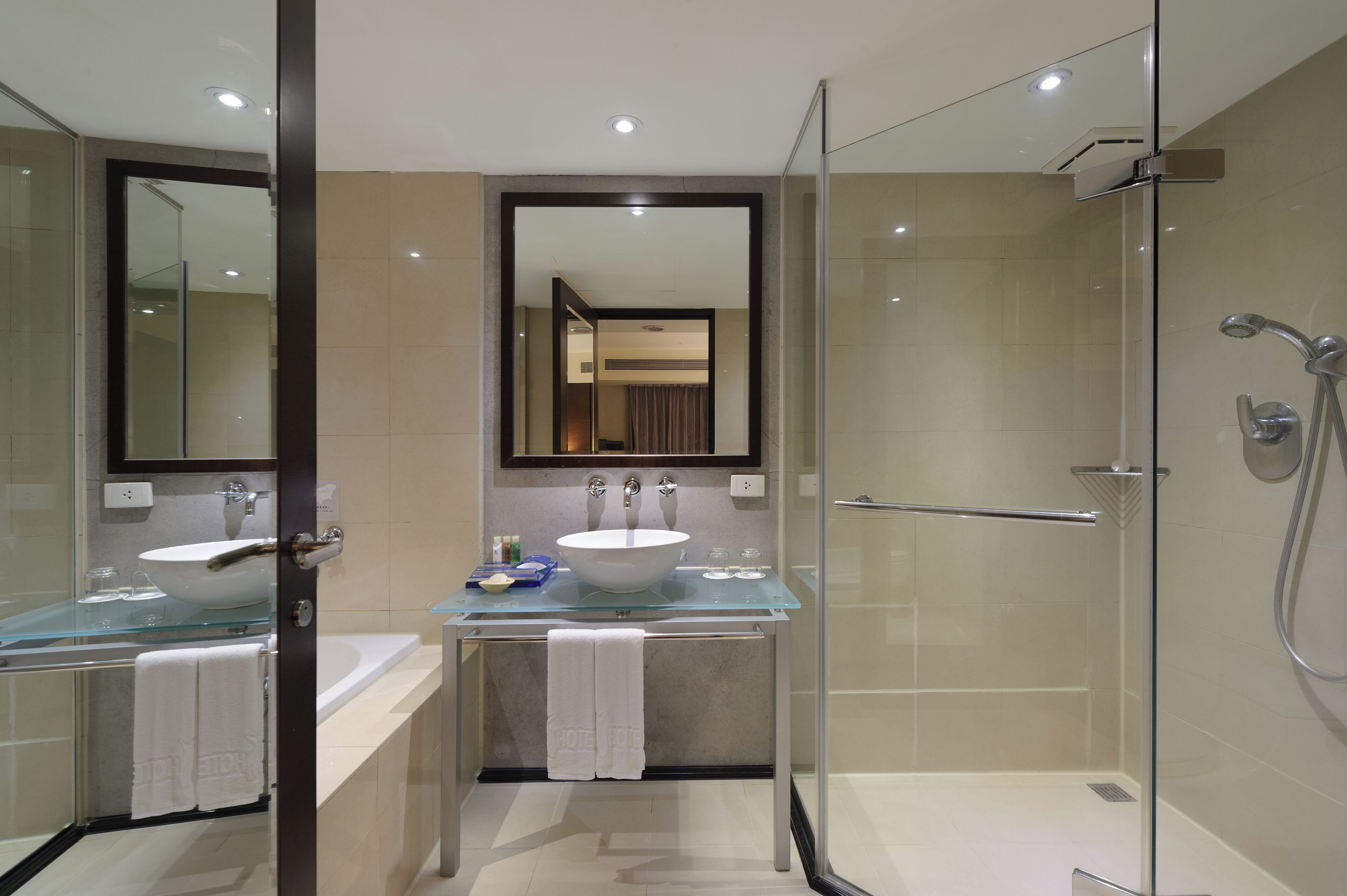 separate bathtub and shower, hair dryer, slippers, towels