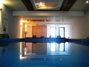 Indoor pool, open 7:00 AM to 8:00 PM, pool loungers