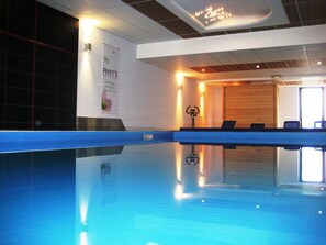 Indoor pool, open 7:00 AM to 8:00 PM, pool loungers