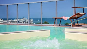 Seasonal outdoor pool, pool umbrellas, sun loungers