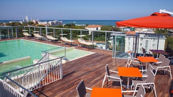 Seasonal outdoor pool, pool umbrellas, pool loungers