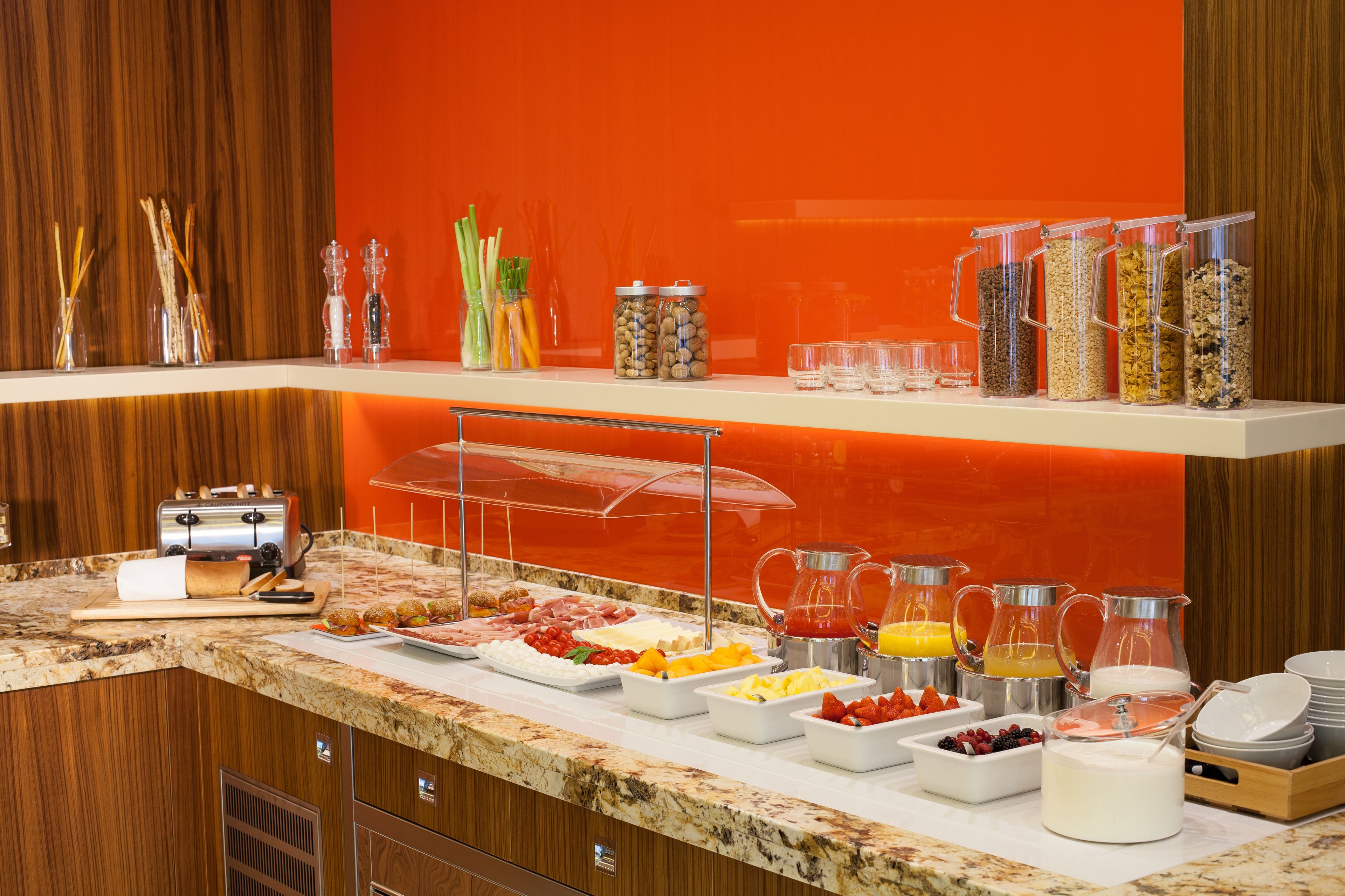 A breakfast buffet with various food items and beverages.