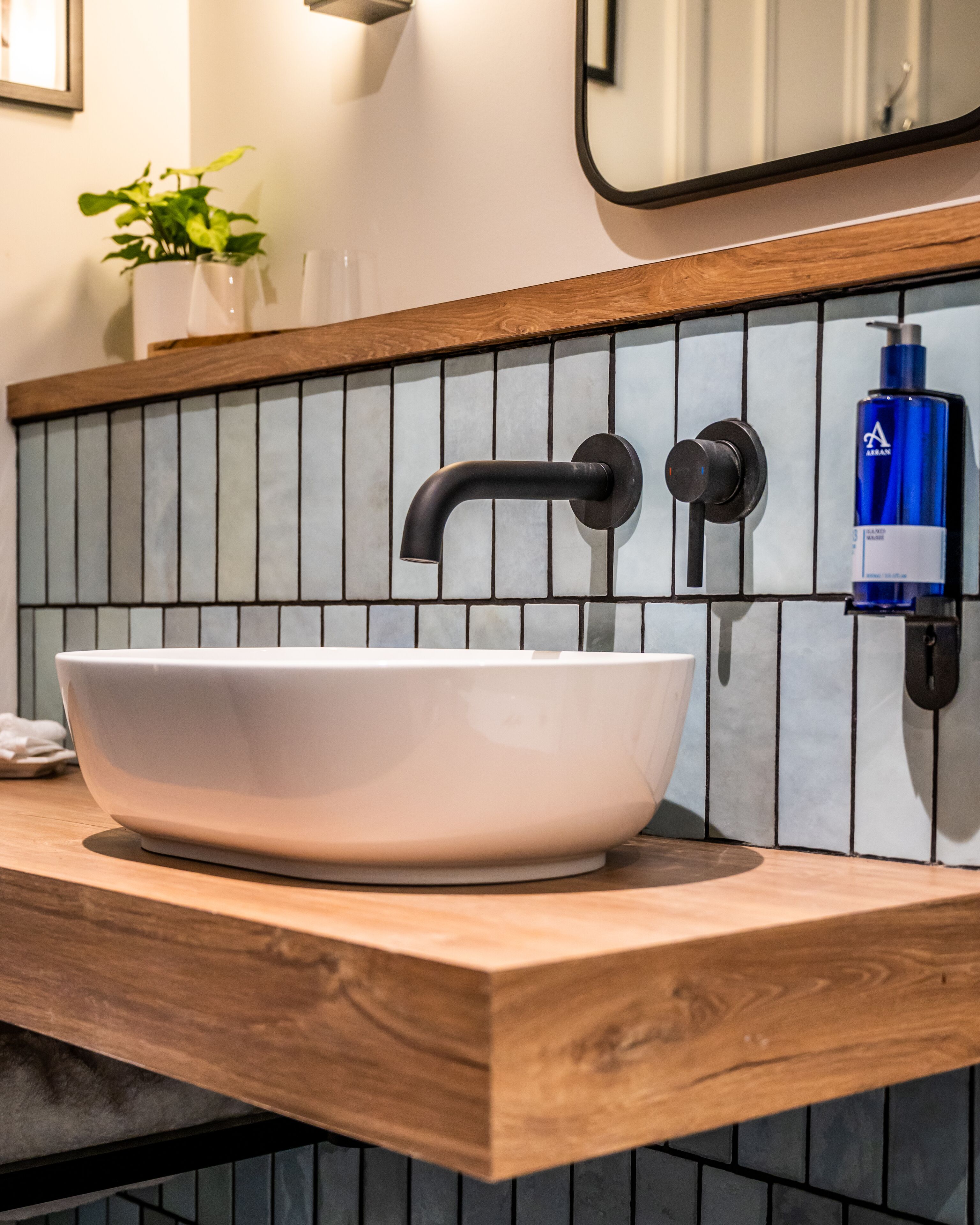 deluxe king or twin guest room | bathroom | designer toiletries, hair dryer, towels