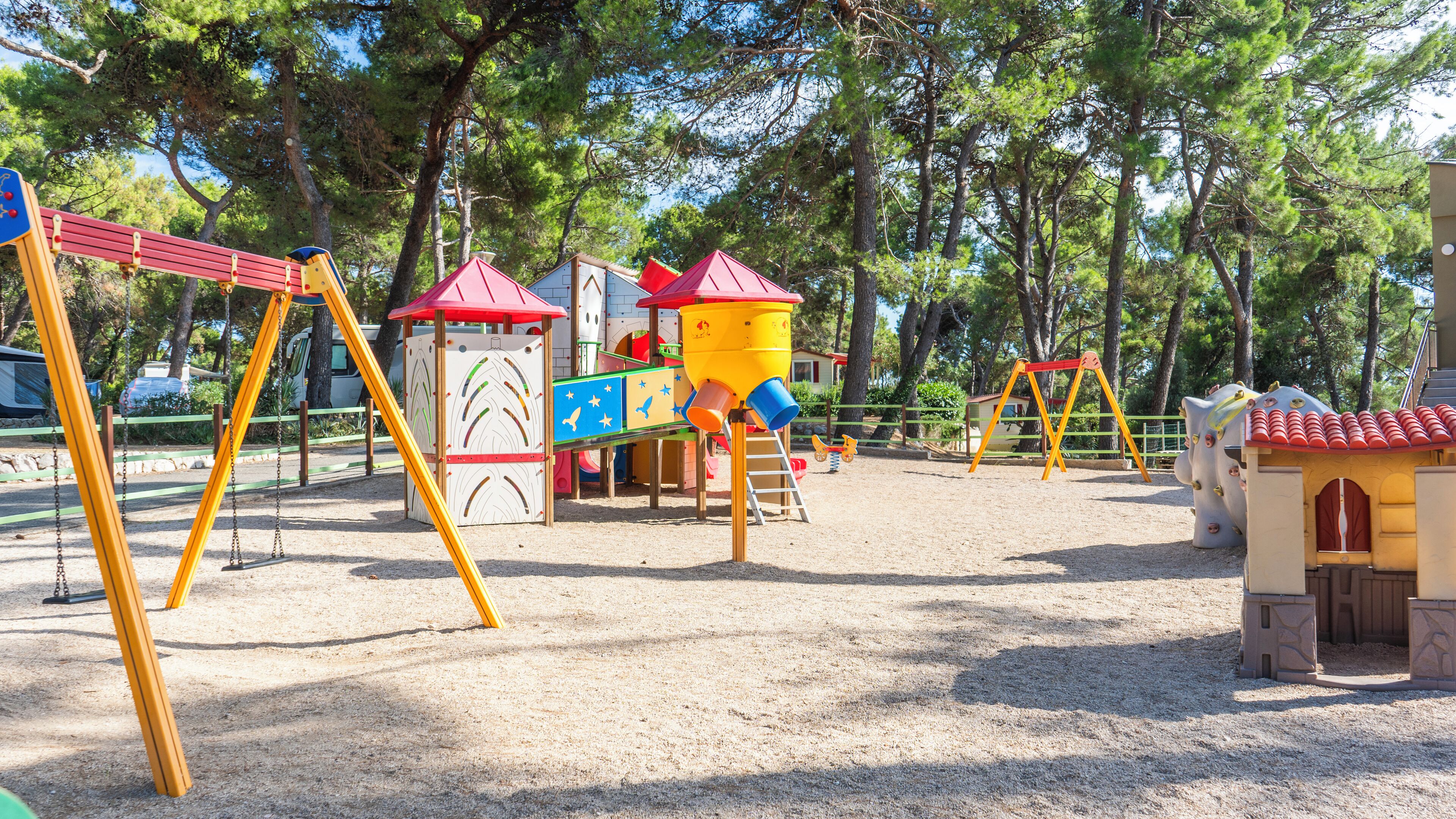 A playground with swings, slides, and climbing structures.