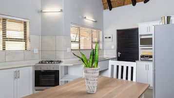 Four Bedroom Luxury Chalet with Splash Pool | Private kitchen | Fridge, coffee/tea maker, electric kettle