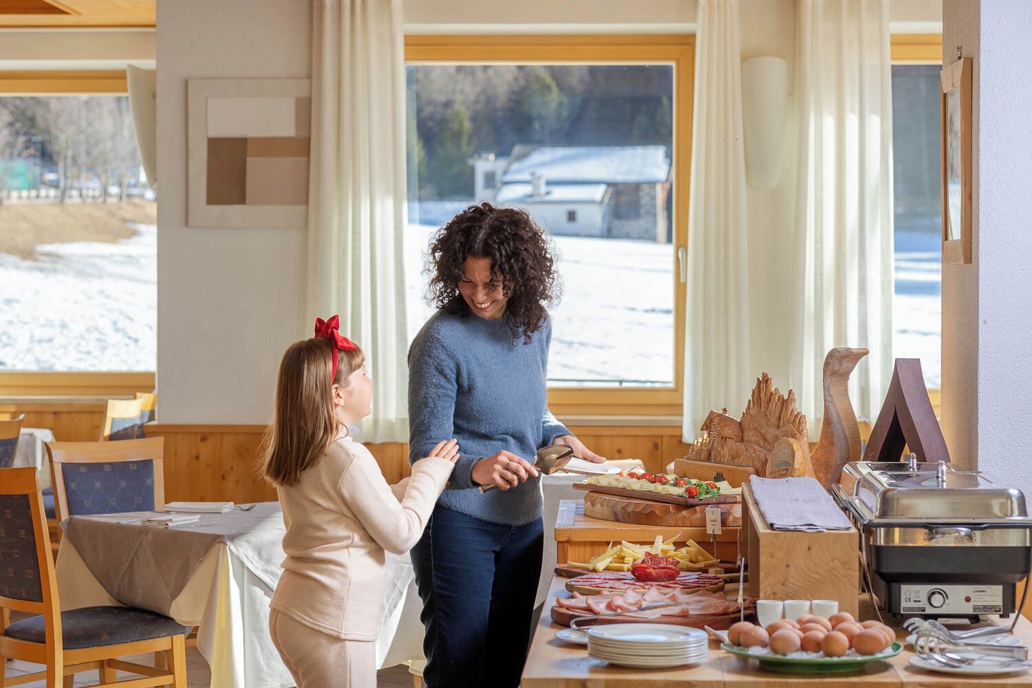 A breakfast buffet with various food items and a toaster.