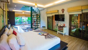 A spacious bedroom with a large bed, a spiral staircase, a TV, and a sliding glass door leading to a balcony. - Vartika Adventure Retreatic Resort (Prachuap Khiri Khan)