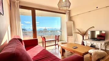 Deluxe Apartment | Living area | 24-inch TV with cable channels