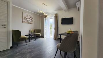 Luxury Apartment, 1 Bedroom, Balcony | Living area | LCD TV