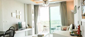 Apartment, 1 Bedroom | Living room | 32-inch flat-screen TV with cable channels, LED TV, DVD player