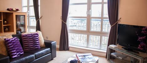 Apartment, 3 Bedrooms (Spittal Street) | Living room | 10-inch TV with cable channels