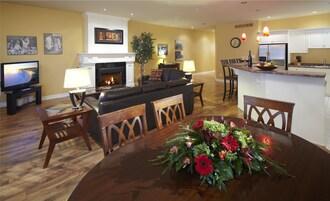 Signature Suite, 2 Bedrooms, 2 Bathrooms | Living area | 65-inch Smart TV with cable channels, fireplace