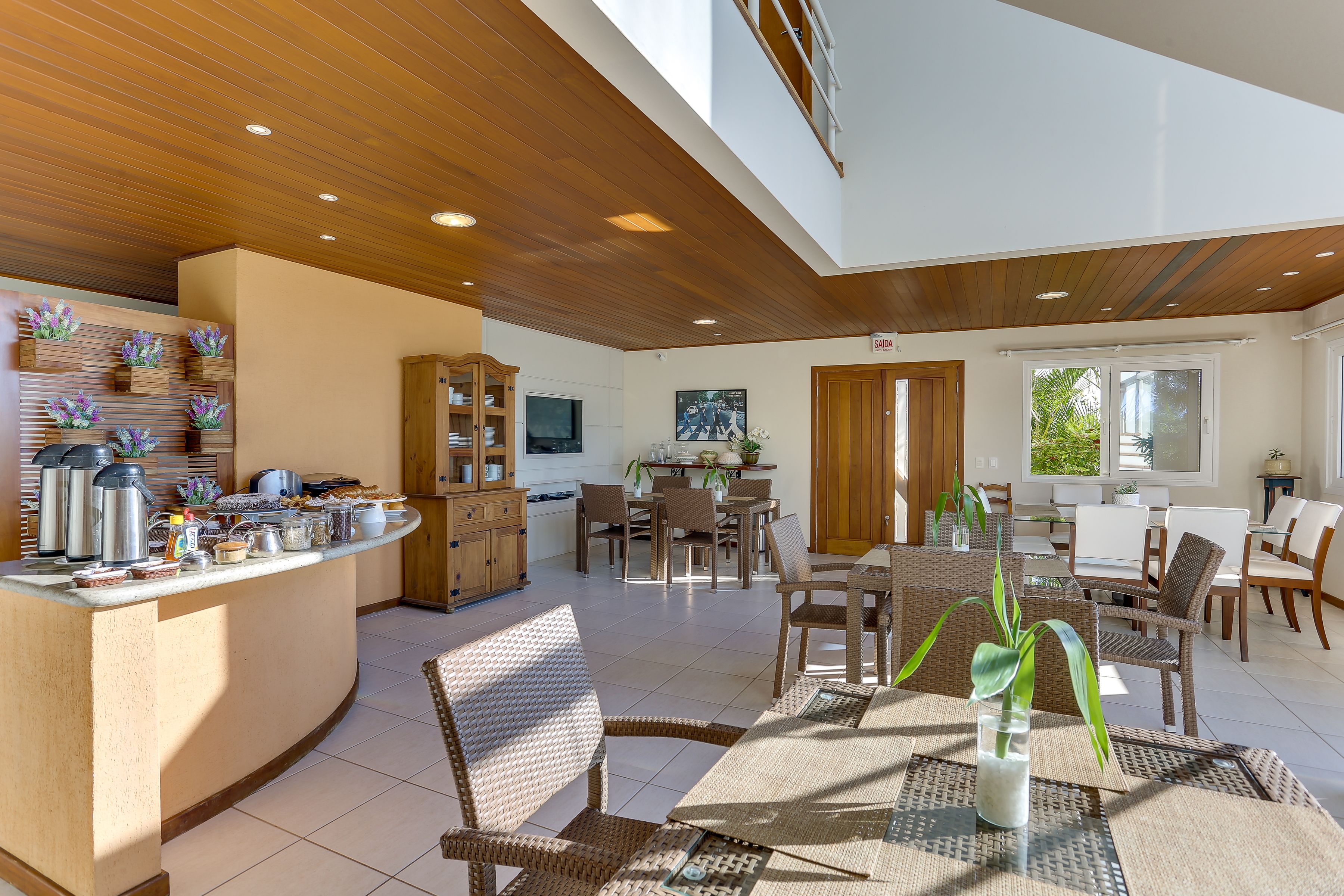 A spacious living area with a kitchen, dining area, and seating space.