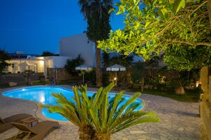 Seasonal outdoor pool, open 10:30 AM to 7:00 PM, pool umbrellas