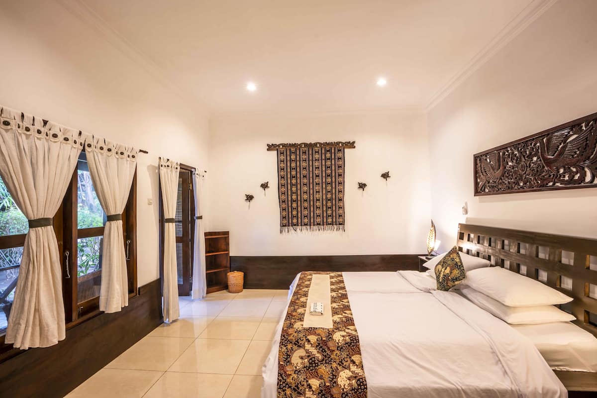Habitación estándar con 1 cama doble o 2 individuales, vistas al jardín | Caja fuerte y sistema de insonorización