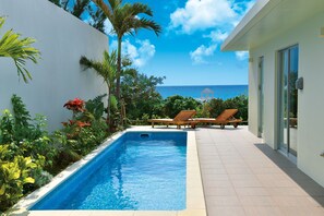 Outdoor pool, a heated pool, sun loungers