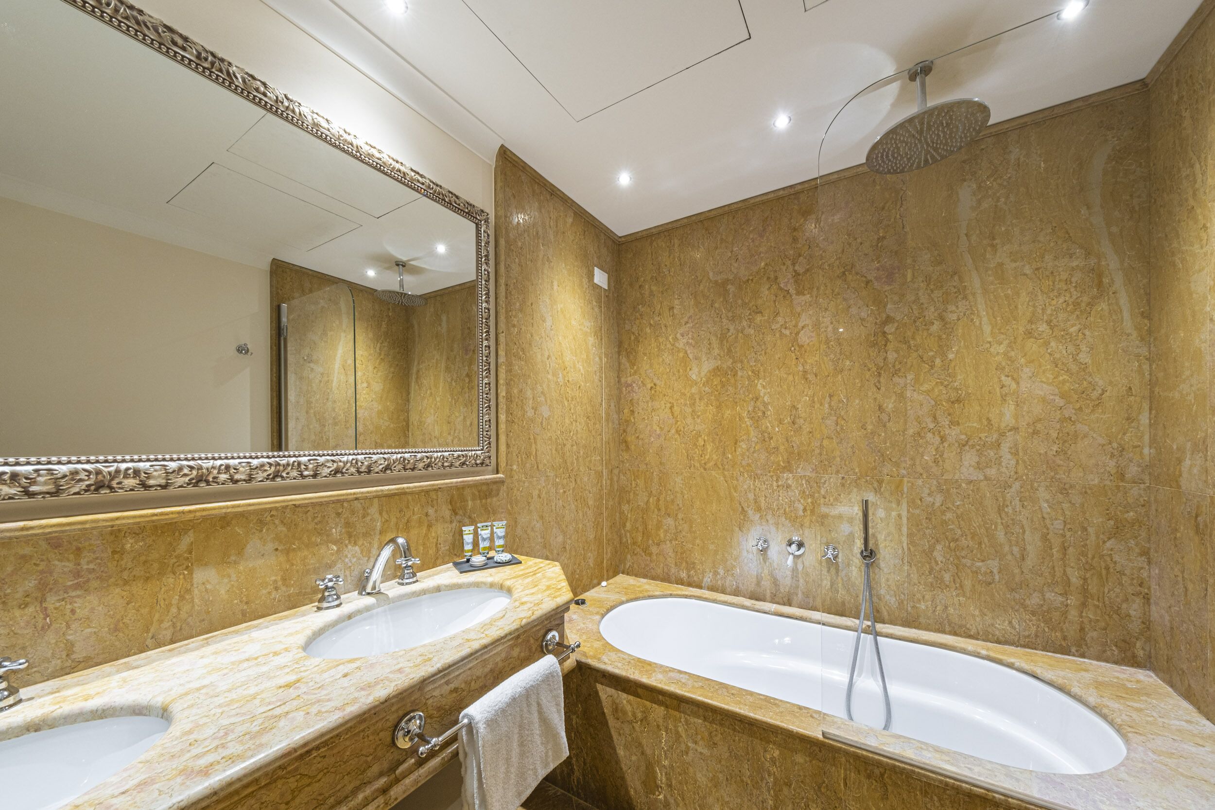 studio suite | bathroom | shower, rainfall showerhead, hair dryer, slippers