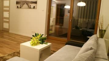 Apartment, 2 Bedrooms (Olive Suite) | Living room | TV
