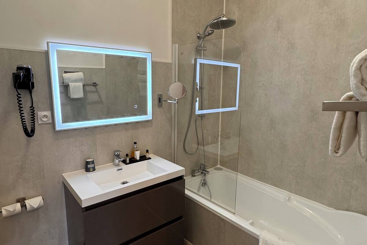 superior double room | bathroom | bathtub, free toiletries, hair dryer, towels
